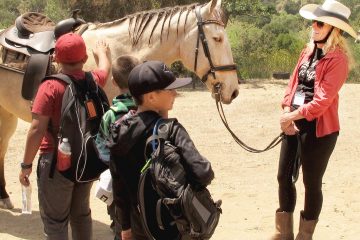 Heidi Marusa and "Jag" show students how to approach a horse.